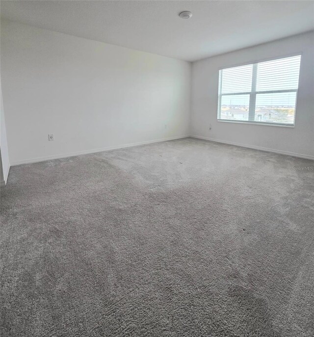 1603 Gardiner St, Haines City, FL 33844 - carpeted spare room with baseboards