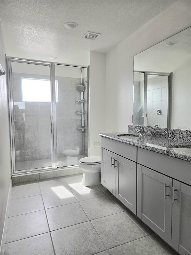 1603 Gardiner St, Haines City, FL 33844 - full bathroom featuring visible vents, a sink, a shower stall, and double vanity