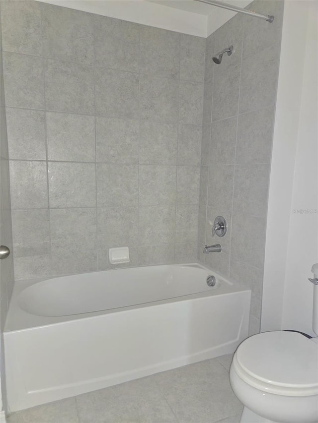 1603 Gardiner St, Haines City, FL 33844 - bathroom with shower / bathtub combination, toilet, and tile patterned floors
