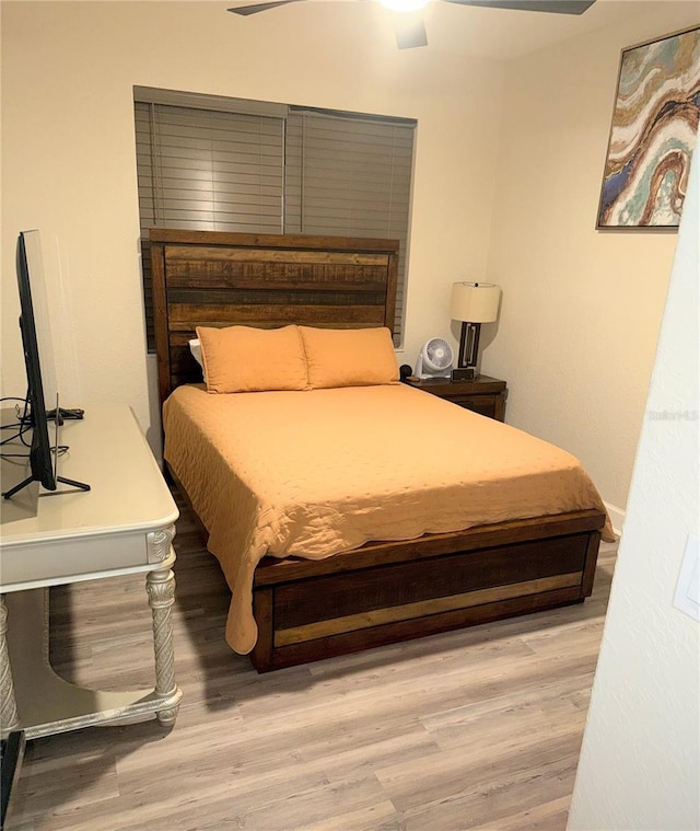 bedroom featuring ceiling fan and light hardwood / wood-style floors