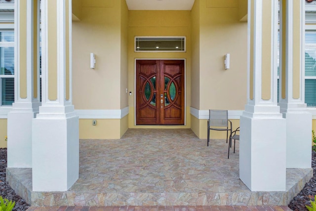 property entrance featuring a wall mounted AC