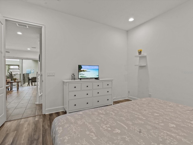 bedroom featuring light hardwood / wood-style floors