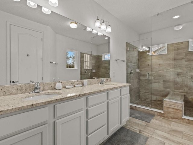 bathroom with vanity and an enclosed shower