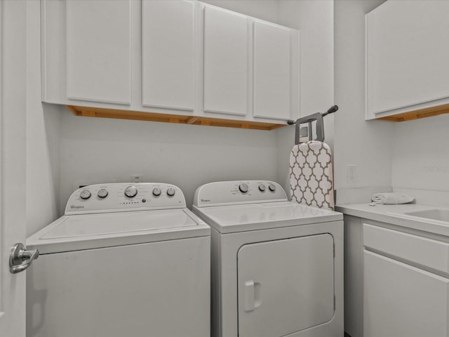 laundry area featuring cabinets and washer and dryer