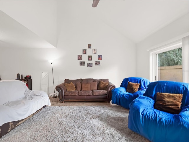 living room featuring tile patterned flooring and lofted ceiling