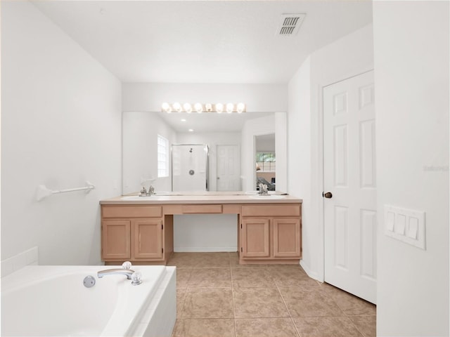 bathroom with plus walk in shower, tile patterned flooring, and vanity