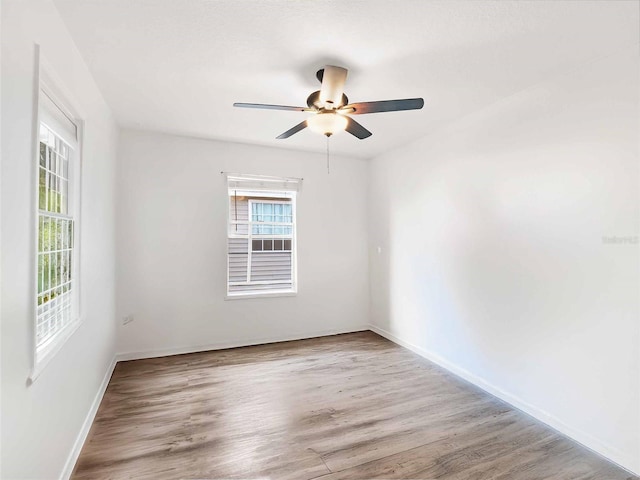 spare room featuring ceiling fan and light wood-type flooring