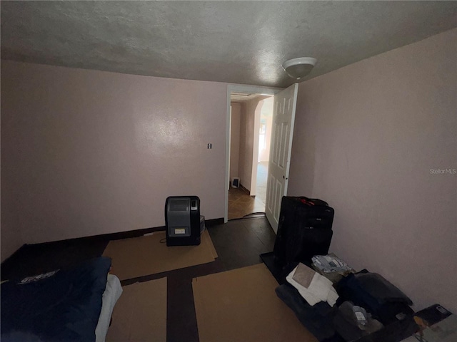 miscellaneous room with a textured ceiling