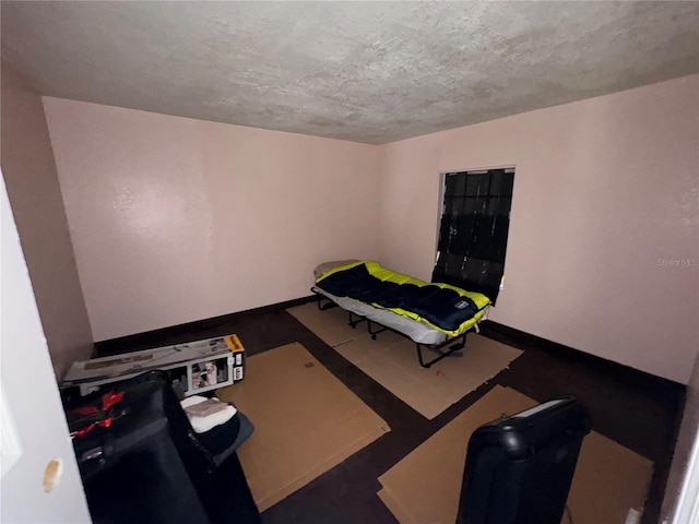 carpeted bedroom with a textured ceiling