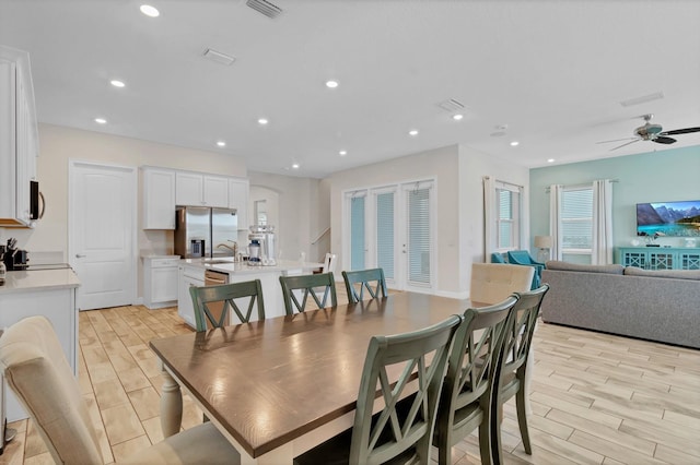 dining room with sink and ceiling fan