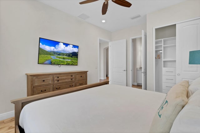 bedroom with ceiling fan and light wood-type flooring