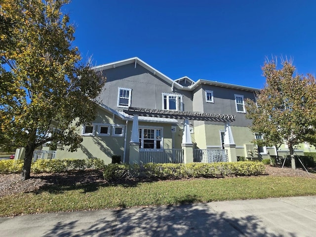 view of front of house with a pergola