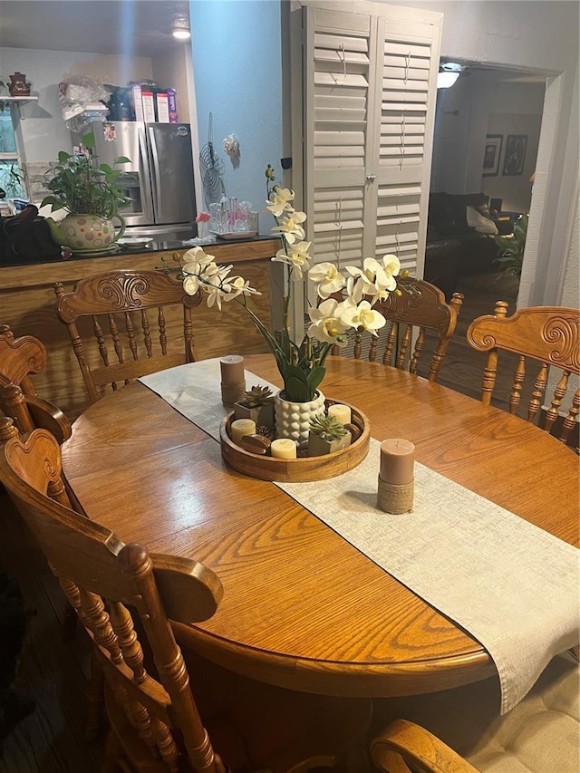 dining area with wood-type flooring