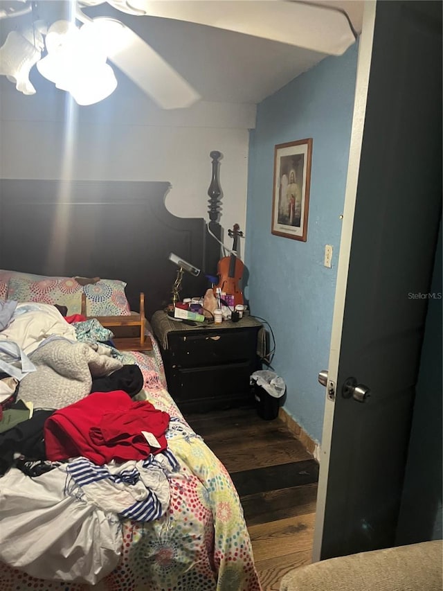 bedroom featuring dark hardwood / wood-style flooring