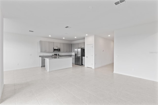 1343 Foran Manor Rd, Haines City, FL 33844 - unfurnished living room with recessed lighting and light tile patterned floors