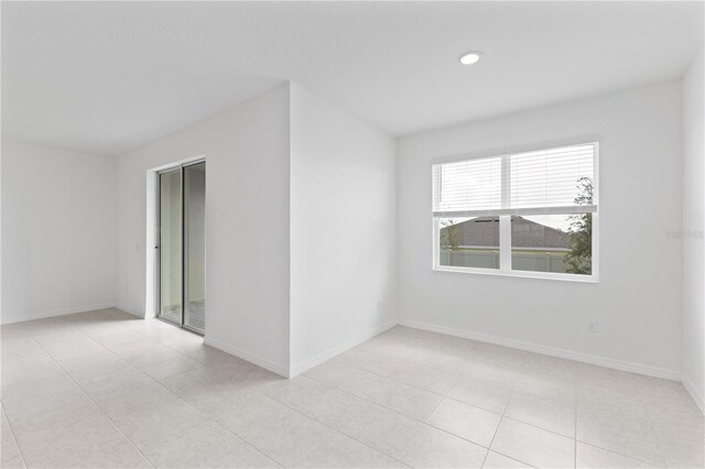 1343 Foran Manor Rd, Haines City, FL 33844 - tiled empty room featuring baseboards and recessed lighting