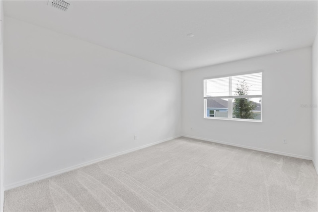 1343 Foran Manor Rd, Haines City, FL 33844 - spare room featuring light colored carpet and baseboards