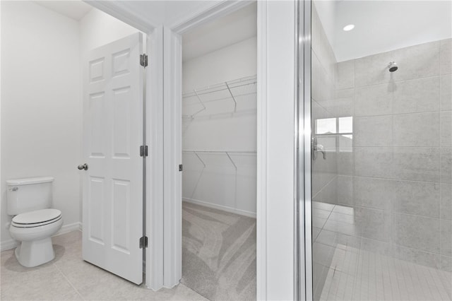 1343 Foran Manor Rd, Haines City, FL 33844 - full bathroom featuring a stall shower, a walk in closet, and tile patterned floors