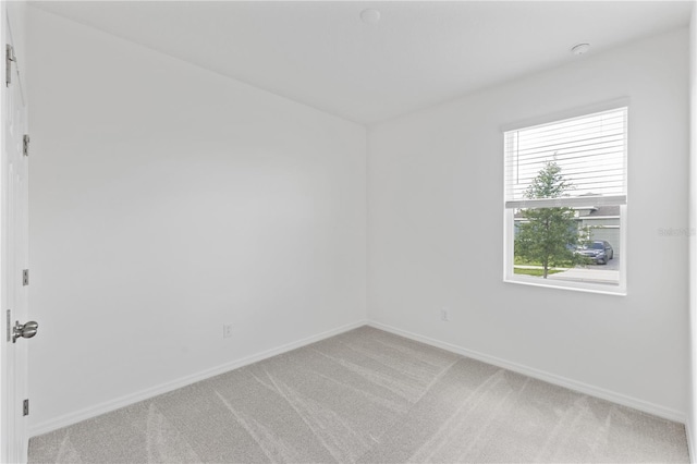 1343 Foran Manor Rd, Haines City, FL 33844 - spare room featuring light carpet and baseboards