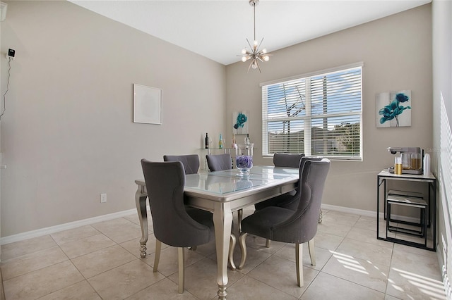 tiled dining space with an inviting chandelier