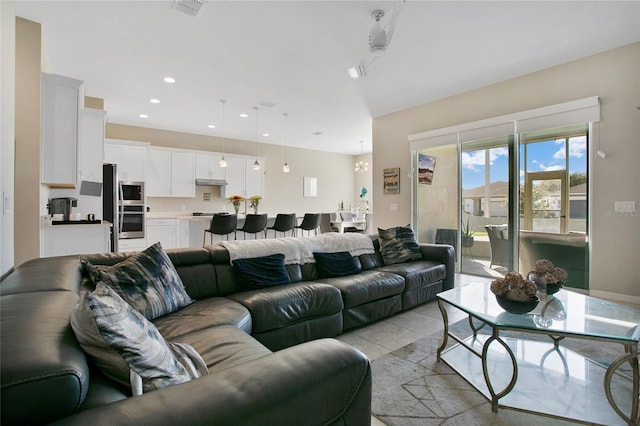 living room with light tile patterned flooring