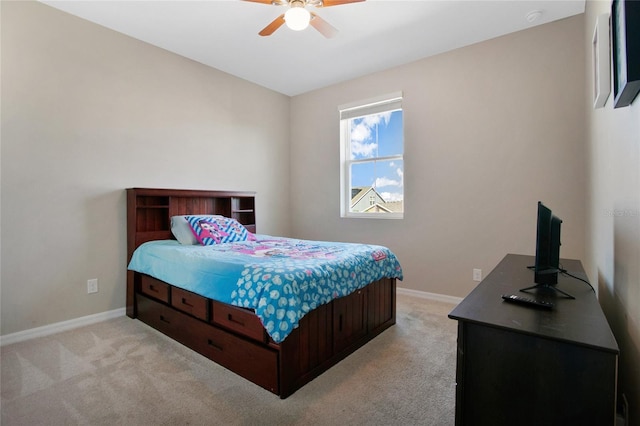 bedroom featuring ceiling fan and light colored carpet