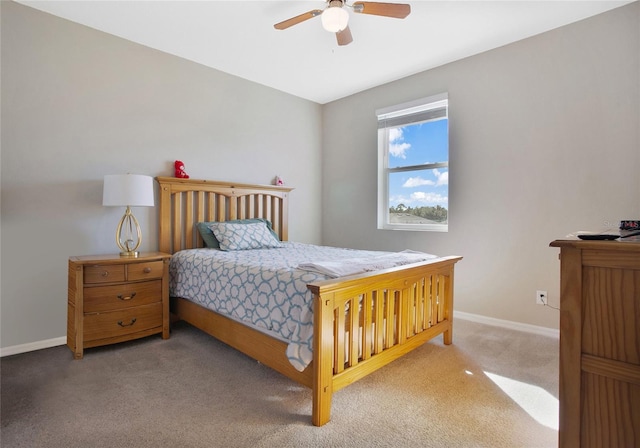 bedroom featuring light colored carpet and ceiling fan