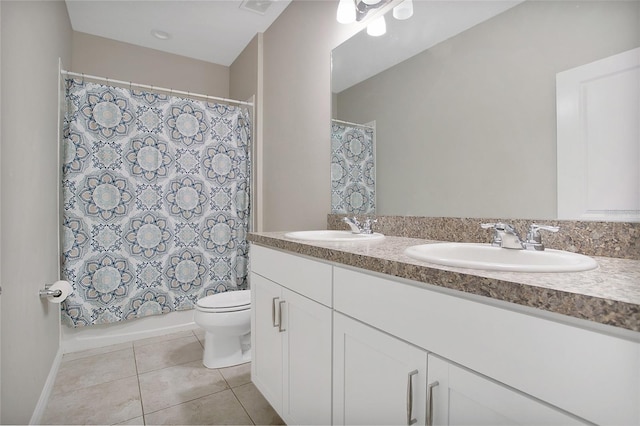 full bathroom featuring vanity, toilet, shower / bath combination with curtain, and tile patterned floors