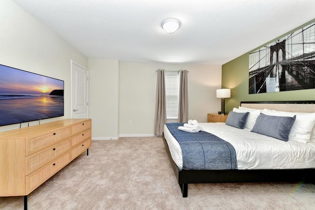 bedroom with light carpet