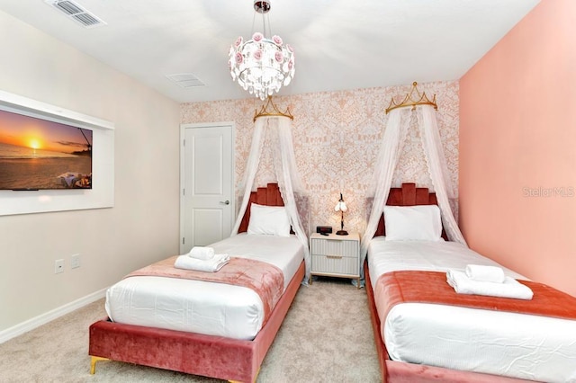 bedroom featuring an inviting chandelier and light carpet