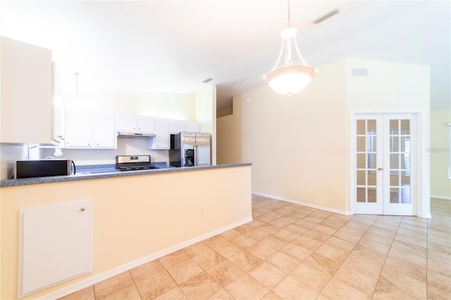 kitchen featuring appliances with stainless steel finishes, lofted ceiling, decorative light fixtures, white cabinetry, and french doors