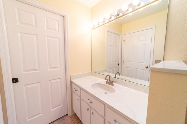 bathroom featuring vanity and tile patterned flooring