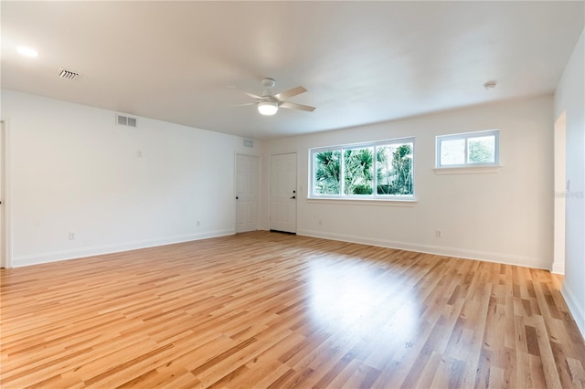 unfurnished room featuring ceiling fan and light wood-type flooring