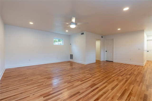 spare room featuring ceiling fan and light wood-type flooring