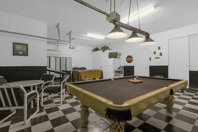 rec room with billiards and a textured ceiling