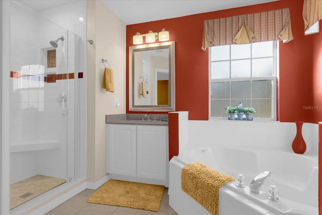 bathroom featuring vanity, tile patterned floors, and separate shower and tub