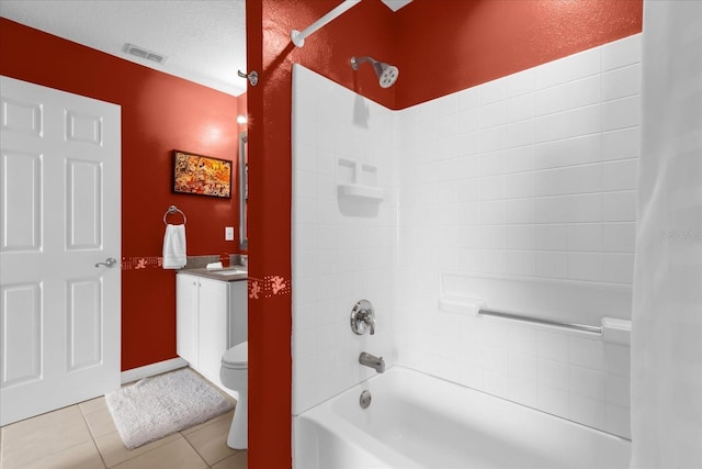 full bathroom featuring vanity, toilet, tub / shower combination, tile patterned floors, and a textured ceiling