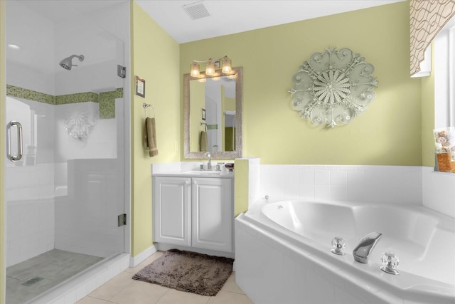 bathroom with vanity, shower with separate bathtub, and tile patterned flooring