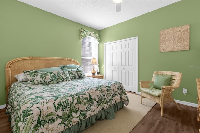 bedroom with ceiling fan, hardwood / wood-style floors, and a closet