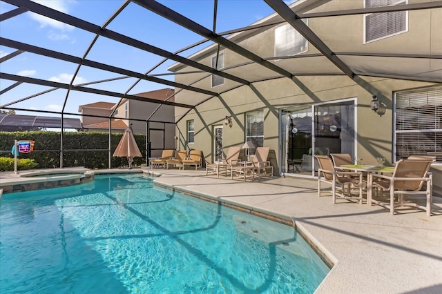 view of pool featuring an in ground hot tub, a lanai, and a patio