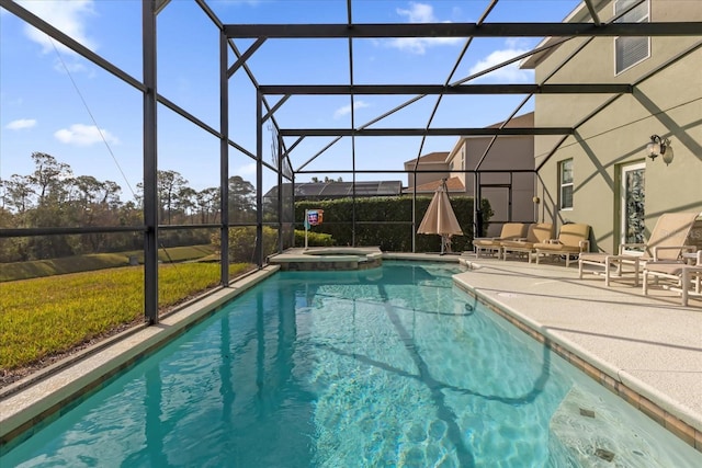 view of swimming pool with an in ground hot tub, glass enclosure, and a patio