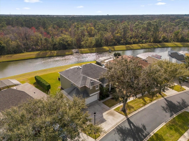 birds eye view of property with a water view