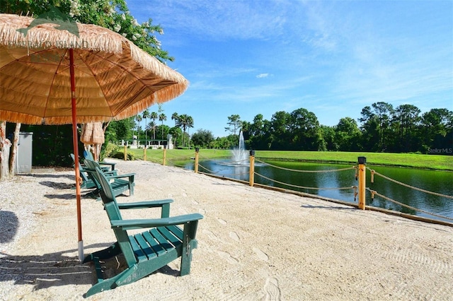 view of community with a water view