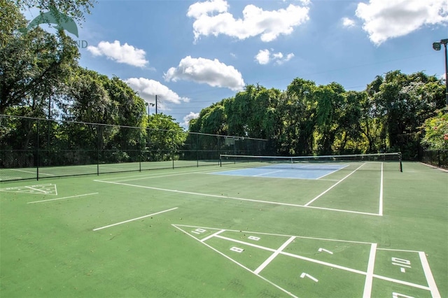 view of community with tennis court