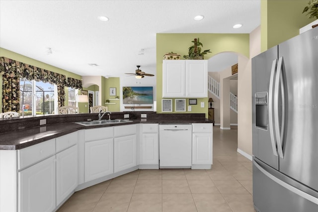 kitchen with stainless steel refrigerator with ice dispenser, dishwasher, sink, and white cabinets