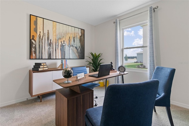 home office featuring a wealth of natural light and light carpet