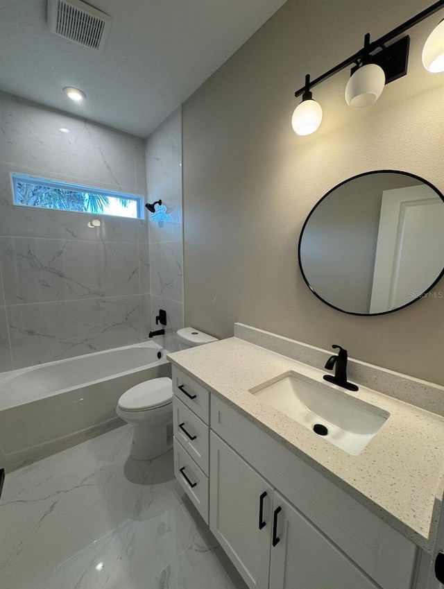 116 E Cleveland St, Apopka, FL 32703 - bathroom featuring vanity, toilet, marble finish floor, visible vents, and shower / bathtub combination