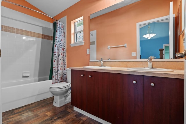 bathroom featuring double vanity, a sink, toilet, and shower / bathtub combination with curtain