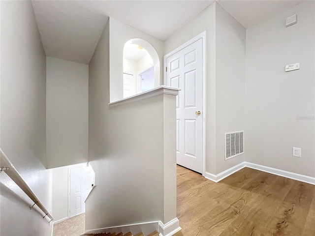 hallway with light hardwood / wood-style flooring