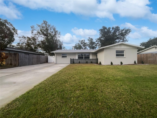 rear view of house featuring a lawn